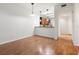 Open-concept dining room leading to the kitchen, offering ample natural light at 1936 Heron Cove Dr # 104, Lutz, FL 33549