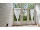 Enclosed patio with large windows offering views of a green yard at 1936 Heron Cove Dr # 104, Lutz, FL 33549