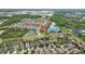 Expansive aerial shot highlighting the property's location, nestled among picturesque lakes and well-maintained roadways at 21642 Emory Oak Pl, Land O Lakes, FL 34637