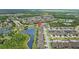 Stunning aerial view of a lakeside community with beautiful homes and lush green landscapes at 21642 Emory Oak Pl, Land O Lakes, FL 34637