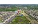 A panoramic aerial view of the property, showcasing its location within a well-planned community and near tranquil lake at 21642 Emory Oak Pl, Land O Lakes, FL 34637