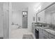 Bright bathroom with a freestanding tub, walk-in shower, double vanity, and modern fixtures create a spa-like feel at 21642 Emory Oak Pl, Land O Lakes, FL 34637