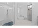 Bright, luxurious bathroom with a freestanding tub, walk-in shower, textured tile, and modern vanity at 21642 Emory Oak Pl, Land O Lakes, FL 34637
