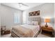 Cozy bedroom with a ceiling fan, neutral decor and a comfortable bed at 21642 Emory Oak Pl, Land O Lakes, FL 34637
