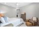 Neutral-toned bedroom with seating area, plush carpeting, and modern furnishings at 21642 Emory Oak Pl, Land O Lakes, FL 34637