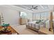 Spacious bedroom with tray ceiling, natural lighting and warm colors at 21642 Emory Oak Pl, Land O Lakes, FL 34637