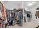 Spacious walk-in closet with dual hanging racks and ample storage space at 21642 Emory Oak Pl, Land O Lakes, FL 34637