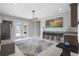 Open dining area featuring bar, seating area and outdoor view at 21642 Emory Oak Pl, Land O Lakes, FL 34637