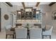 Elegant dining room with a stylish chandelier, a wine rack and seating for six at 21642 Emory Oak Pl, Land O Lakes, FL 34637