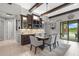 Dining room featuring a bar area and elegant decor at 21642 Emory Oak Pl, Land O Lakes, FL 34637