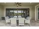 Comfortable outdoor seating area with views of pool and lake at 21642 Emory Oak Pl, Land O Lakes, FL 34637