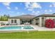 Wonderful backyard pool, patio, and lush garden, perfect for Florida living and outdoor enjoyment at 21642 Emory Oak Pl, Land O Lakes, FL 34637
