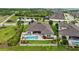 Lovely backyard featuring a pristine pool, relaxing patio area, manicured lawn, and lush landscaping for outdoor enjoyment at 21642 Emory Oak Pl, Land O Lakes, FL 34637