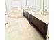 Bathroom with double vanity sinks, large tub and tile flooring at 2233 Springwood W Cir, Clearwater, FL 33763
