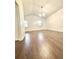 Simple yet spacious bedroom with hardwood floors and plenty of natural light at 2233 Springwood W Cir, Clearwater, FL 33763