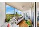 Relaxing balcony with comfortable seating and scenic views. Decorative skeleton figure at 2333 Feather Sound Dr # B309, Clearwater, FL 33762