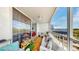 Relaxing balcony with tile flooring and seating offers a comfortable extension of the living space at 2333 Feather Sound Dr # B309, Clearwater, FL 33762
