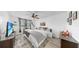 Bright bedroom with a ceiling fan, a window, and natural light at 2333 Feather Sound Dr # B309, Clearwater, FL 33762