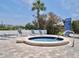 Tranquil community hot tub surrounded by lounge chairs and shade trees, perfect for unwinding after a long day at 2333 Feather Sound Dr # B309, Clearwater, FL 33762