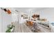 Open-concept dining room featuring modern decor and seamless flow to the kitchen at 2333 Feather Sound Dr # B309, Clearwater, FL 33762