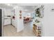 Bright hallway with neutral tile flooring leading to the kitchen and living areas at 2333 Feather Sound Dr # B309, Clearwater, FL 33762