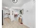 Bright hallway with neutral tile flooring leading to the kitchen and living areas at 2333 Feather Sound Dr # B309, Clearwater, FL 33762