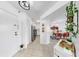 Bright hallway with neutral tile flooring leading to the kitchen and living areas at 2333 Feather Sound Dr # B309, Clearwater, FL 33762