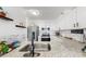 Kitchen features granite countertops, stainless steel appliances, and modern white cabinets at 2333 Feather Sound Dr # B309, Clearwater, FL 33762
