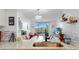 Bright living room with modern decor, an open layout, and a view of the outdoors at 2333 Feather Sound Dr # B309, Clearwater, FL 33762