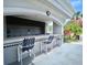 Inviting outdoor kitchen area with counter seating, perfect for entertaining guests in style at 2333 Feather Sound Dr # B309, Clearwater, FL 33762