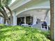 Spacious outdoor patio showcasing ample seating with ceiling fans and lush landscaping at 2333 Feather Sound Dr # B309, Clearwater, FL 33762