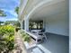 Outdoor patio area offering ample seating and views of landscaped grounds, perfect for relaxation at 2333 Feather Sound Dr # B309, Clearwater, FL 33762