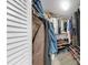 Walk-in closet filled with clothing and shoe racks at 2333 Feather Sound Dr # B309, Clearwater, FL 33762