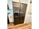 Kitchen features updated stainless steel refrigerator with water dispenser and laundry appliances at 2424 W Tampa Bay Blvd # 203, Tampa, FL 33607