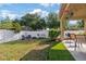 Spacious backyard with patio, fire pit, seating area, and privacy fence, ideal for entertaining at 2903 Cypress Bowl Rd, Lutz, FL 33558