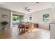 Dining room with natural light, table, seating, and access to outdoor covered patio at 2903 Cypress Bowl Rd, Lutz, FL 33558