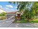 Charming one-story home with a well-maintained yard, beautiful landscaping and two-car garage at 2903 Cypress Bowl Rd, Lutz, FL 33558