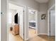 Hallway offering views into bedrooms, showcasing the home's layout and design at 2903 Cypress Bowl Rd, Lutz, FL 33558