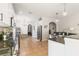 Well-appointed kitchen featuring granite countertops, modern stainless steel appliances, and tile flooring at 2903 Cypress Bowl Rd, Lutz, FL 33558
