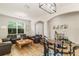 Bright living room with hardwood floors, a large window, modern lighting and neutral paint at 2903 Cypress Bowl Rd, Lutz, FL 33558