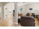 Spacious living room featuring tile and wood flooring, an archway, and comfortable seating at 2903 Cypress Bowl Rd, Lutz, FL 33558