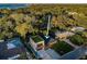 An aerial view features the house and its manicured lawn at 3165 Renatta Dr, Belleair Bluffs, FL 33770