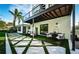 The ultimate backyard: Modern patio and synthetic grass offers the perfect outdoor living space at 3165 Renatta Dr, Belleair Bluffs, FL 33770