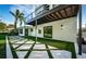 Stylish backyard featuring modern design and an architectural staircase at 3165 Renatta Dr, Belleair Bluffs, FL 33770