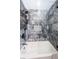 Stylish bathroom featuring marble tile, a glass-enclosed shower and tub, and modern fixtures at 3165 Renatta Dr, Belleair Bluffs, FL 33770