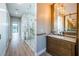 Modern bathroom features a glass shower with marble accents and a wood vanity with marble countertop at 3165 Renatta Dr, Belleair Bluffs, FL 33770