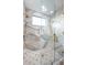 Modern bathroom with a glass-enclosed shower and stylish tile work at 3165 Renatta Dr, Belleair Bluffs, FL 33770
