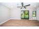 Relaxing bedroom with views, new floors, ceiling fan and plenty of light at 3165 Renatta Dr, Belleair Bluffs, FL 33770