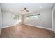 Bright bedroom with hardwood floors and large windows providing ample natural light and closet at 3165 Renatta Dr, Belleair Bluffs, FL 33770