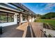 Stunning exterior view of the home showcasing a covered deck and beautifully landscaped yard at 3165 Renatta Dr, Belleair Bluffs, FL 33770
